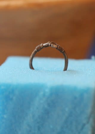 A silver ring is displayed during the presentation of a new discovery tin the Monkey Valley near the Valley of the Kings in Luxor