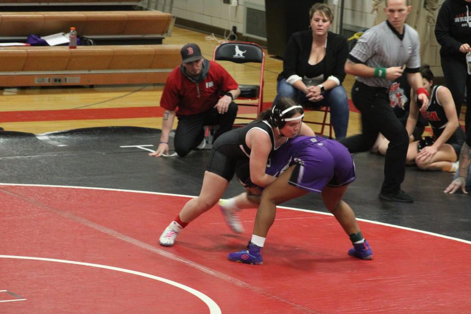 Keokuk's Jalyiah Gardner (right) works for a takedown on her way to a 7-4 decision over Fort Madison's Tatum Peters during the Fort Madison Girls Wrestling Invitational Monday at the Hound Dome in Fort Madison.