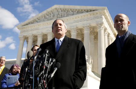 FILE PHOTO: Texas Attorney General Ken Paxton addresses reporters on the steps of the U.S. Supreme Court in Washington, DC, U.S., March 2, 2016. At right is Texas Solicitor General Scott Keller. REUTERS/Kevin Lamarque/File Photo