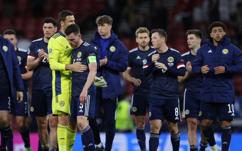 Euro 2020 - Group D - Croatia v Scotland - Hampden Park, Glasgow, Scotland, Britain - June 22, 2021 Scotland's Andrew Robertson looks dejected with teammates after the match - REUTERS