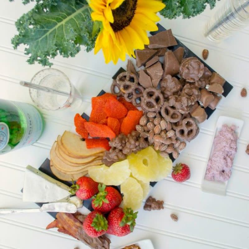 <p>Revel and Glitter</p><p>You'll love how sweet dried fruits are incorporated into this delicious dessert board that also has some great salty snacks! You don't have to commit to being a sweet or salty person in this perfect charcuterie board. </p><p><strong>Get the recipe: <a href="https://revelandglitter.com/2017/07/sweet-salty-dessert-chacuterie-board/" rel="nofollow noopener" target="_blank" data-ylk="slk:Sweet & Salty Dessert Charcuterie;elm:context_link;itc:0;sec:content-canvas" class="link ">Sweet & Salty Dessert Charcuterie</a></strong></p>