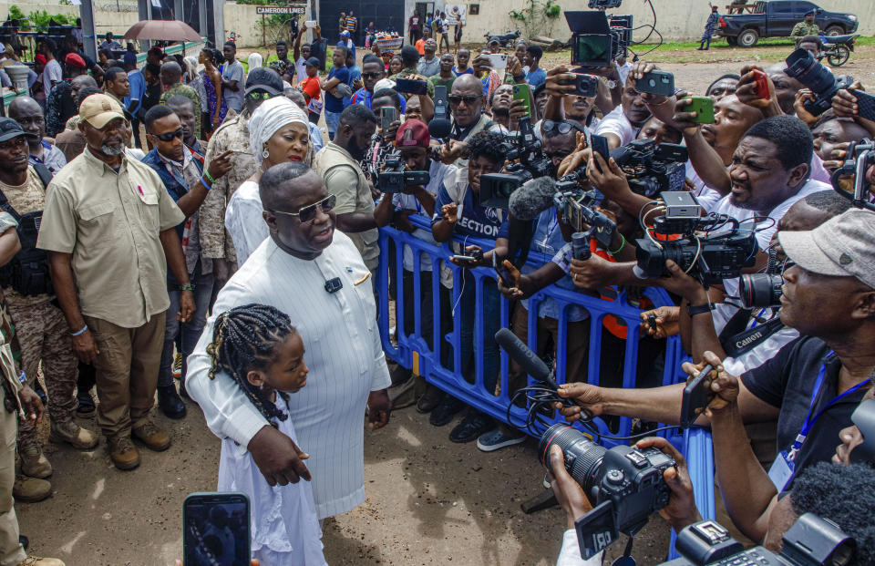 Sierra Leone President Julius Maada Bio speaks to reporters after casting his ballot in Sierra Leone general elections in Freetown, Saturday June 24, 2023. Sierra Leoneans are selecting their next president amid mounting frustration due to an ailing economy, rising unemployment and the loom of deadly protests (AP Photo/TJ Bade)