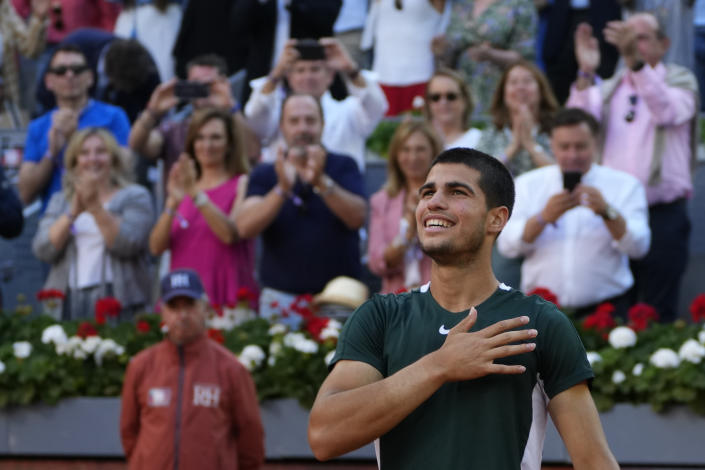 Carlos Alcaraz, of Spain, celebrates after winning the final match against Alexander Zverev, of Germany, at the Mutua Madrid Open tennis tournament in Madrid, Spain, Sunday, May 8, 2022. (AP Photo/Paul White)