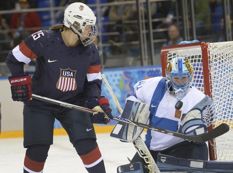 Alex Carpenter of the US tries to score against Finland's goalkeeper Noora Raty during the Women's Ice Hockey Group A match at the Shayba Arena during the Sochi Winter Olympics on February 8, 2014