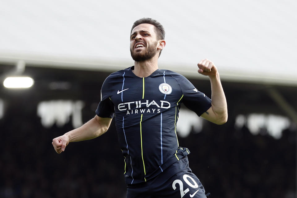 Manchester City's Bernardo Silva celebrates after scoring the opening goal during the English Premier League soccer match between Fulham and Manchester City at Craven Cottage stadium in London, Saturday, March 30, 2019. (AP Photo/Alastair Grant)