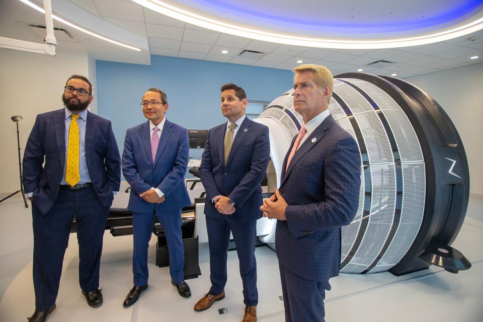 (L-R) Shabbar Danish, M.D., chair of neurosurgery, Timothy Chen, M.D., medical director of CNS radiation oncology program and proton therapy department of radiation oncology, Kenneth N. Sable, M.D., MBA, FACEP, regional president southern market, and Robert C. Garrett, FACHE, CEO of Hackensack Meridian Health speak during the unveiling of the ZAP-X Gyroscopic Radiosurgery for treatment of brain tumors and other conditions of the head and neck at the Dr. Robert H. and Mary Ellen Harris ZAP-X Center for Noninvasive Neurosurgery at Hackensack Meridian Neuroscience Institute of Jersey Shore University Medical Center in Neptune, NJ Thursday, September 7, 2023. The ZAP-X Gyroscopic Radiosurgery is combined with Synaptive MRI to shorten the time between a patient's diagnosis and treatment.