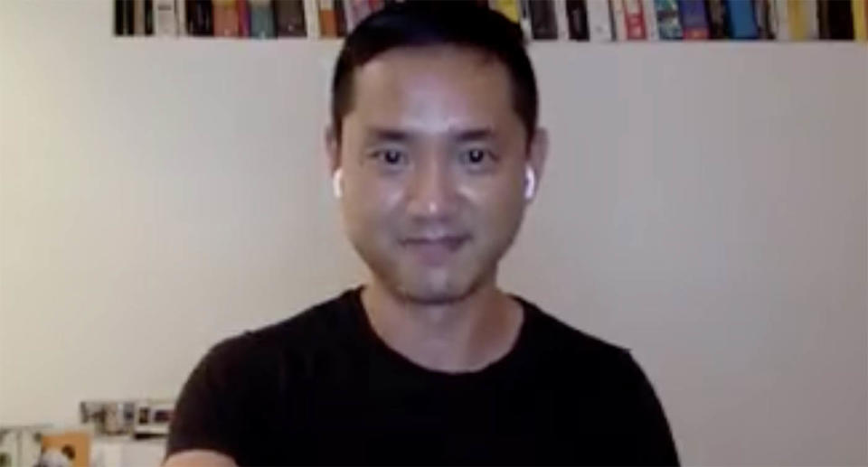 Dr Suan with airpods in wearing black shirt in a screenshot from video explaining why Sydney could be in danger over Christmas.