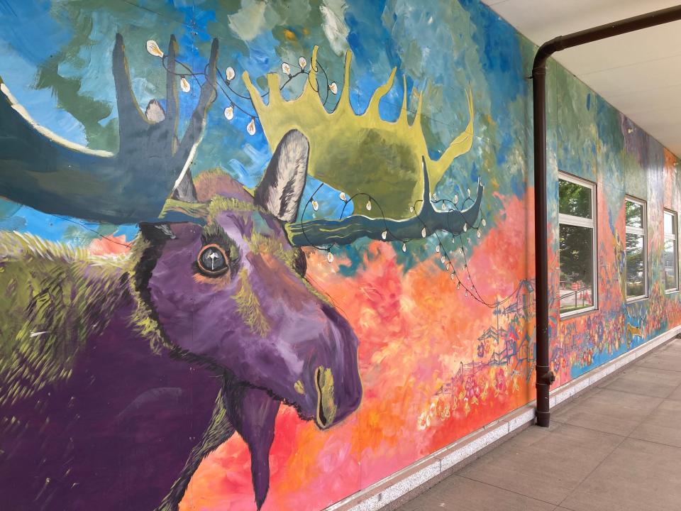 A mural by the Poppyclock Collective, shown Aug. 3, 2023, adorns the entrance to City Market on Flynn Avenue in Burlington.