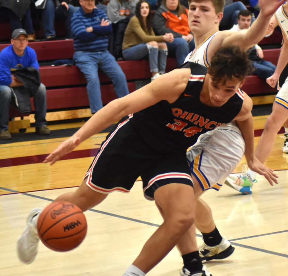 Quincy senior Tre'Von Bodley makes a move baseline versus Centreville Monday night