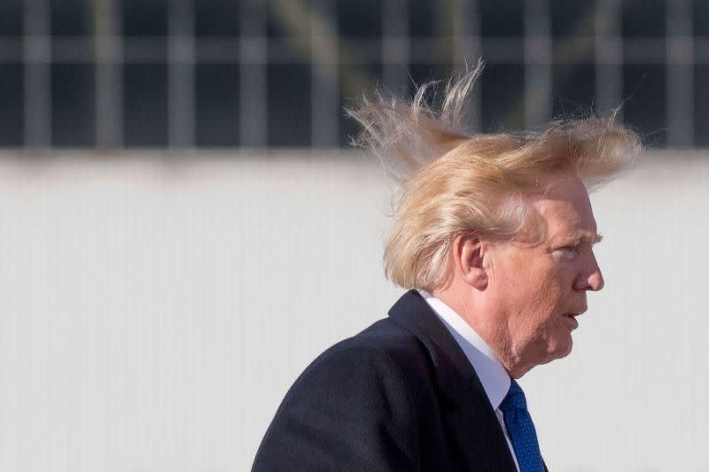 Donald Trump's hair fighting the wind this week. Photo: Getty