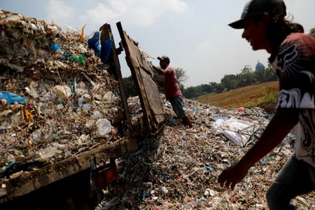 The Wider Image: Cash for trash: Indonesia village banks on waste recycling
