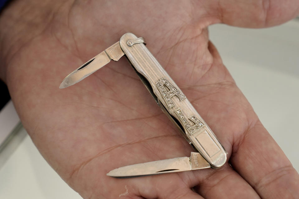 A platinum and diamond pocket knife with the name AL in diamonds that once belonged to mob boss Al Capone is seen on display at Witherell's Auction House in Sacramento, Calif., Wednesday, Aug. 25, 2021. The knife is among the 174 family heirlooms that will be up for sale at an Oct. 8 auction titled "A Century of Notoriety: The Estate of Al Capone," that will be held by Witherell's in Sacramento. (AP Photo/Rich Pedroncelli)