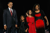U.S. President elect Barack Obama acknowledges his supports along with his wife Michelle (R) and daughters Malia (2nd R) and Sasha to during an election night gathering in Grant Park on November 4, 2008 in Chicago, Illinois. (Photo by Joe Raedle/Getty Images)