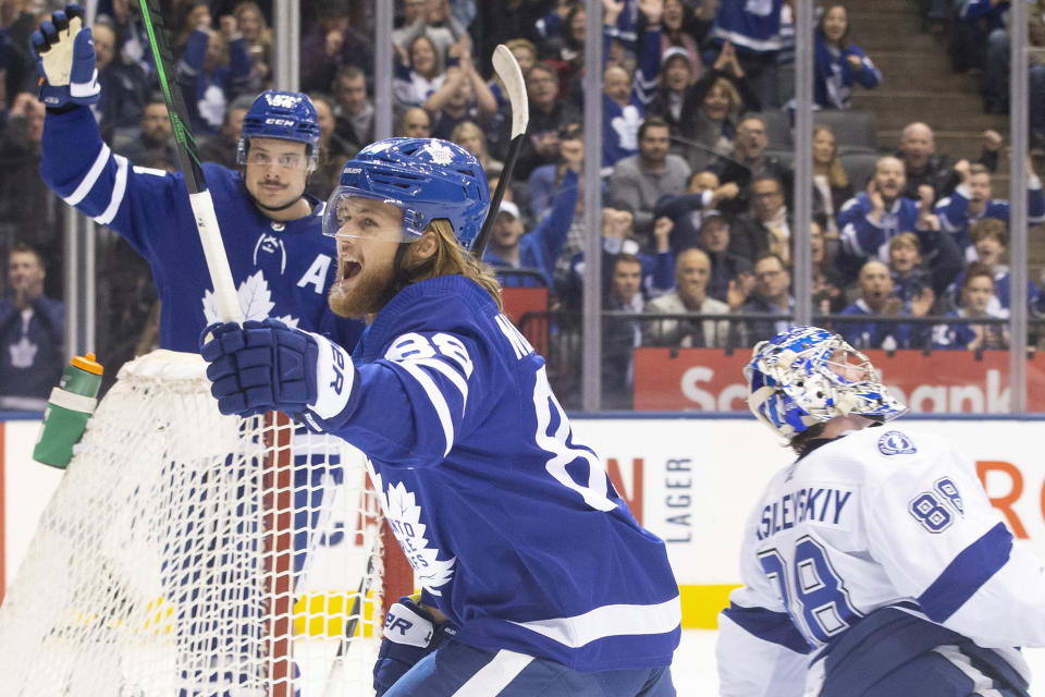 Toronto Maple Leafs right wing William Nylander, foreground, celebrates his goal on Tampa Bay Lightning goaltender Andrei Vasilevskiy, right, during the first period of an NHL hockey game Tuesday, March 10, 2020, in Toronto. (Chris Young/The Canadian Press via AP)