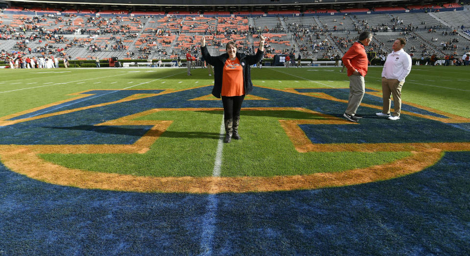 In this Nov. 17, 2018 photo provided by Auburn University Athletics, Dee Ford poses for a photo at midfield at Jordan-Hare Stadium in Auburn, Ala. An Englishwoman has seen the best and worst that Twitter would have to offer the American football player who shares her name, if he had an account. Dee Ford told the Kansas City Star she was deluged with angry tweets from Kansas City Chiefs fans who thought they were venting at linebacker Dee Ford after his late penalty during Sunday's AFC Championship loss. Oddly enough, she became a fan of the player and sport after being inadvertently tagged in a positive tweet to the player five years ago. She has spoken to the Chiefs' Dee Ford by phone and attended two games — an Auburn home game last fall and a Chiefs game in London in 2015. (Todd Van Emst/Auburn University Athletics via AP)