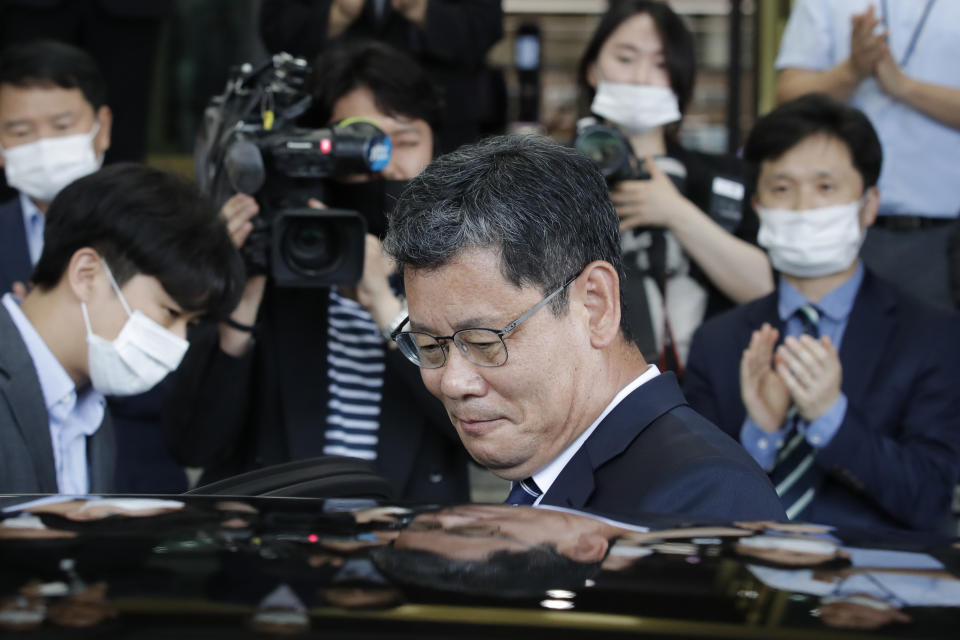 South Korean Unification Minister Kim Yeon-chul gets into a car as he leaves the government complex in Seoul, South Korea, Friday, June 19, 2020. South Korean President Moon Jae-in on Friday accepted the resignation of his point man on North Korea, who had asked to quit after the North destroyed a liaison office while ramping up pressure against Seoul amid stalled nuclear negotiations with the Trump administration. (AP Photo/Lee Jin-man)