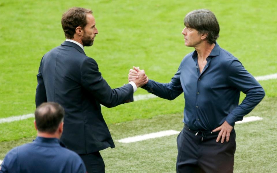 Southgate shakes hands with Germany manager Joachim Low at full time - GETTY IMAGES