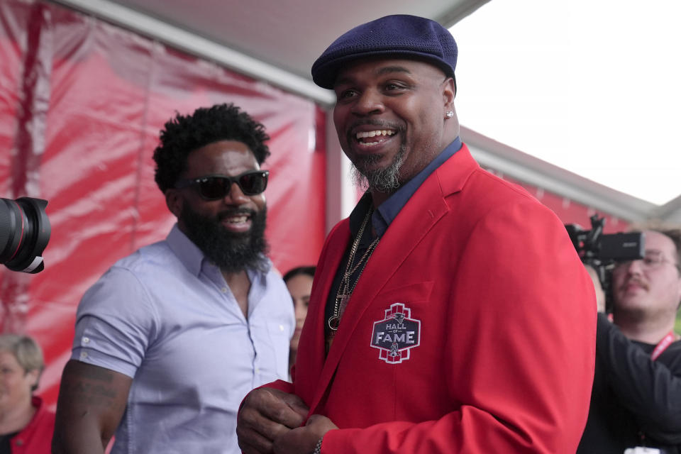 Former New England Patriots Vince Wilfork, right, arrives for the Patriot Hall of Fame induction ceremony for former Patriots quarterback Tom Brady, at Gillette Stadium, Wednesday, June 12, 2024, in Foxborough, Mass. (AP Photo/Steven Senne)