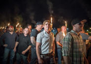 <p>Chanting “White lives matter! You will not replace us! and Jews will not replace us!,” several hundred white nationalists and white supremacists carrying torches marched in a parade through the University of Virginia campus last night.<br> Beginning a little after 9:30 p.m., the march lasted 15 to 20 minutes before ending in skirmishing when the marchers were met by a small group of counterprotesters at the base of a statue of Thomas Jefferson, the universitys founder. (Photo: Evelyn Hockstein/For The Washington Post via Getty Images) </p>