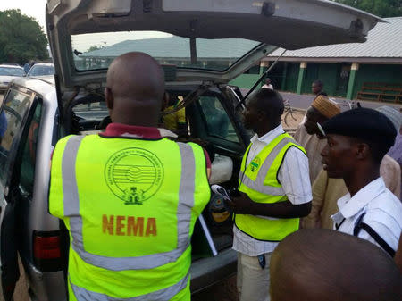 Members of the National Emergency Management Agency (NEMA) evacuate casualties from the site of blasts attack in Mubi, in northeast Nigeria May 1, 2018. NEMA/Handout via REUTERS.