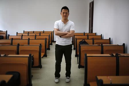 Cai Hua, who was born in 1979, poses for a photograph in Shanghai August 30, 2014. REUTERS/Carlos Barria