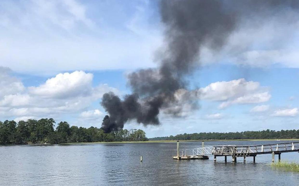 Smoke rises at the site of a F-35 jet crash in Beaufort, South Carolina, US, September 28, 2018. - REUTERS