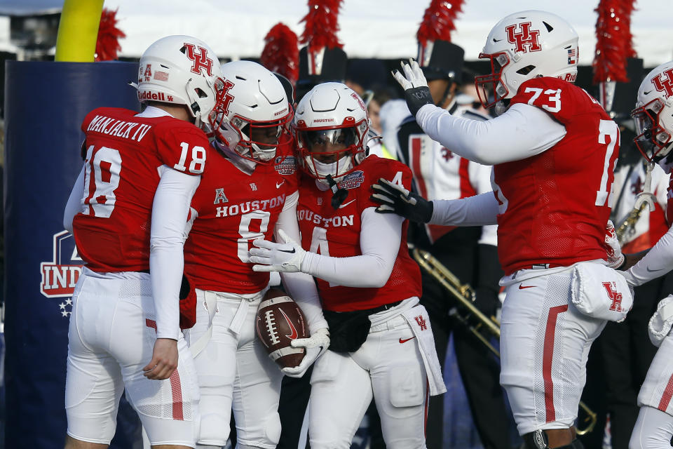 Dec 23, 2022; Shreveport, Louisiana, USA; Houston Cougars wide receiver KeSean Carter (8) reacts with wide receiver Joseph Manjack IV (18), running back Ta’Zhawn Henry (4) and offensive linemen Cam’Ron Johnson (73) after catching a pass for a touchdown during the first half against the Louisiana-Lafayette Ragin’ Cajuns in the 2022 Independence Bowl at Independence Stadium. Mandatory Credit: Petre Thomas-USA TODAY Sports