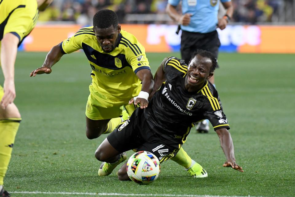 Nashville SC's Dru Yearwood, left, collides with the Crew's Yaw Yeboah on Saturday.