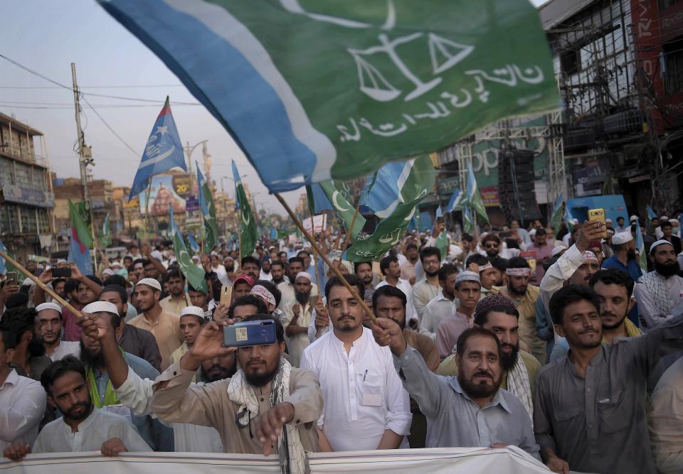 Supporters of the Pakistani religious party Jamaat-e-Islami, participate in a rally to denounce the United Arab Emirates-Israeli deal to establish full diplomatic ties between the two countries, in Rawalpindi, Pakistan, Sunday, Aug. 16, 2020. (AP Photo/A. H. Chaudary)