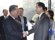 South Korean Unification Minister Cho Myoung-gyon, right, shakes hands with his North Korean counterpart Ri Son Gwon before their meeting at the southern side of Panmunjom in the Demilitarized Zone, South Korea, Monday, Oct. 15, 2018. The rival Koreas are holding high-level talks Monday to discuss further engagement amid a global diplomatic push to resolve the nuclear standoff with North Korea. (Korea Pool/Yonhap via AP)