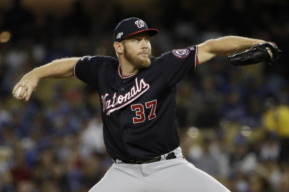 Washington Nationals starting pitcher Stephen Strasburg throws to a Los Angeles Dodgers batter during the first inning in Game 2 of a baseball National League Division Series on Friday, Oct. 4, 2019, in Los Angeles. (AP Photo/Marcio Jose Sanchez)