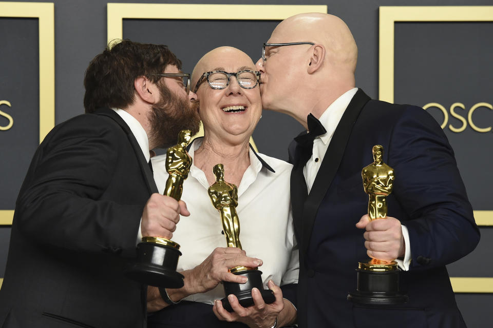 FILE - Jeff Reichert, from left, Julia Reichert, and Steven Bognar, winners of the award for best documentary feature for "American Factory", pose in the press room at the Oscars in Los Angeles on Feb. 9, 2020. Julia Reichert, the Oscar-winning documentary filmmaker whose films explored themes of race, class and gender, often in the Midwest, died Thursday in Ohio from cancer, her family said Friday through a representative. She was 76 .(Photo by Jordan Strauss/Invision/AP, File)