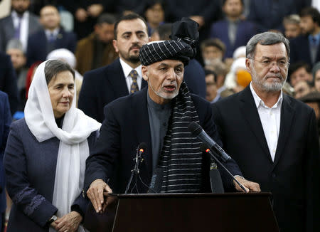 Afghanistan's President Ashraf Ghani, next to his wife Rula Ghani and his second vice president candidate Sarwar Danish (R), speaks to the media after arriving to register as a candidate for the upcoming presidential election at the Afghanistan's Independent Election Commission (IEC) in Kabul, Afghanistan January 20, 2019.REUTERS/Omar Sobhani