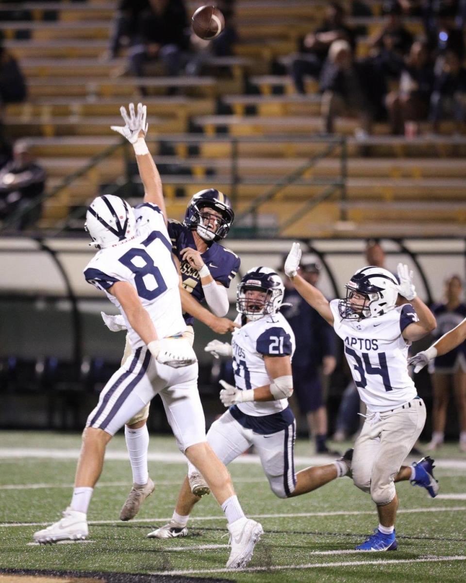 Quarterback Thomas Glenn throws under pressure from the Aptos defense in MIssion Prep’s 18-15 win at home at Cal Poly’s Spanos Stadium on Sept. 8, 2023. David Middlecamp/dmiddlecamp@thetribunenews.com