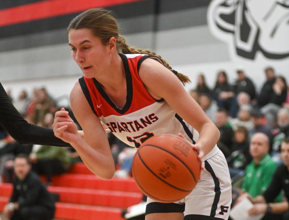 Pleasant's Whitney Waddell drives to the basket during a home girls basketball game with Clear Fork this season. Waddell was named January's Fahey Bank Athlete of the Month for Marion County girls.