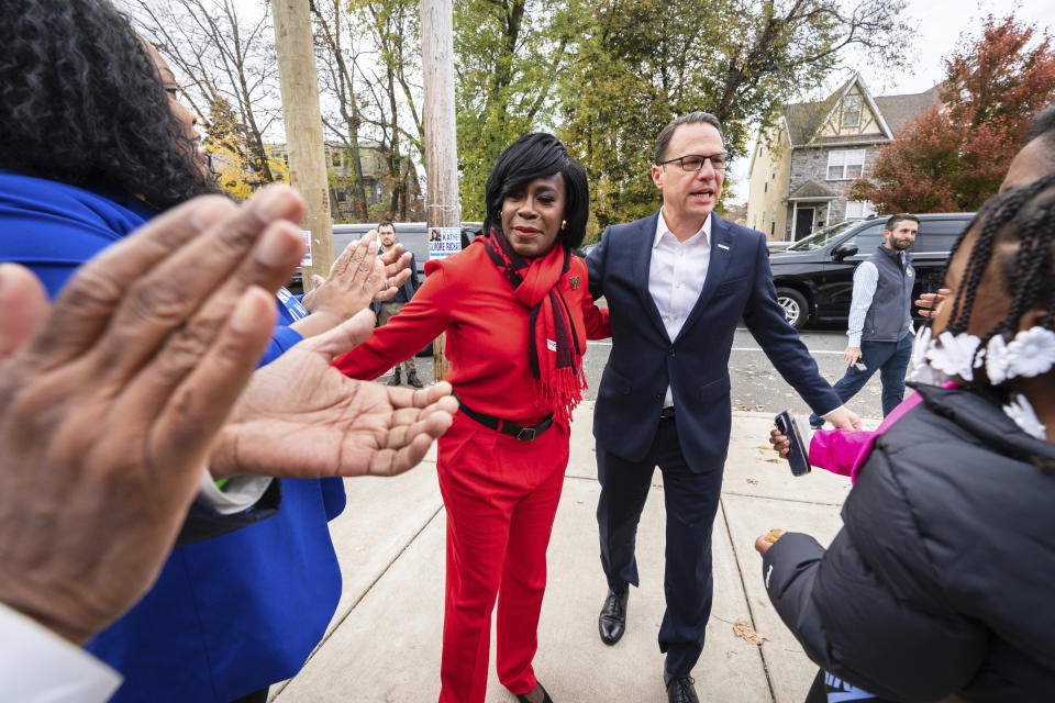 Democratic candidate for Philadelphia Mayor Cherelle Parker, left, and Pennsylvania Gov Josh Shapiro, right, campaign at Pinn Memorial Baptist Church on Election Day, Tuesday, Nov. 7, 2023, in Philadelphia. (Jessica Griffin/The Philadelphia Inquirer via AP)