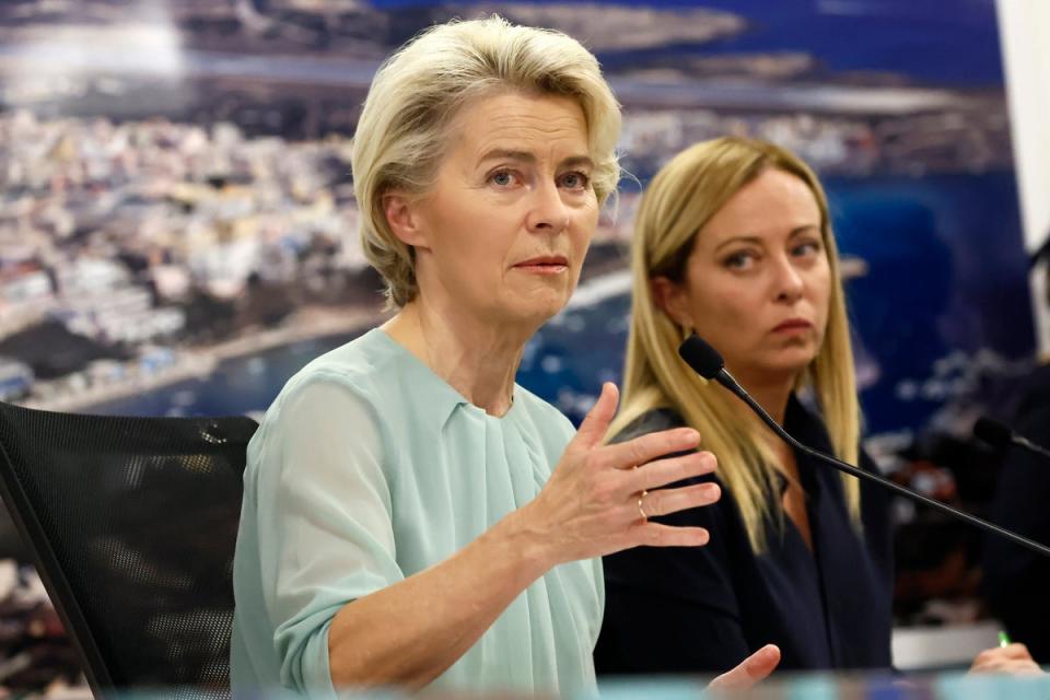 Italy’s far-right premier Giorgia Meloni, right, has been courted by both Ursula von der Leyen, left, and France’s Marine Le Pen (AP)