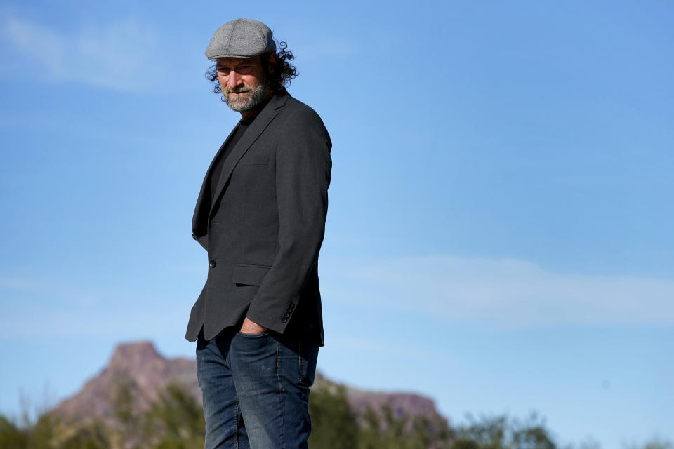 Troy Kotsur, nominated for an Oscar for best supporting actor for his role in the film "CODA," poses for a photo at Red Rock Park in Mesa, Ariz., on Jan. 28, 2022. (AP Photo/Matt York)