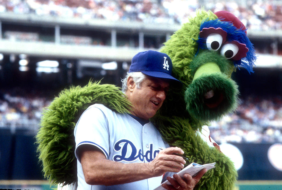 Tommy Lasorda of the Los Angeles Dodgers with the Phillie Fanatic during an MLB baseball game at Veterans Stadium circa 1981 in Philadelphia, Pennsylvania. (Photo by Focus on Sport/Getty Images)