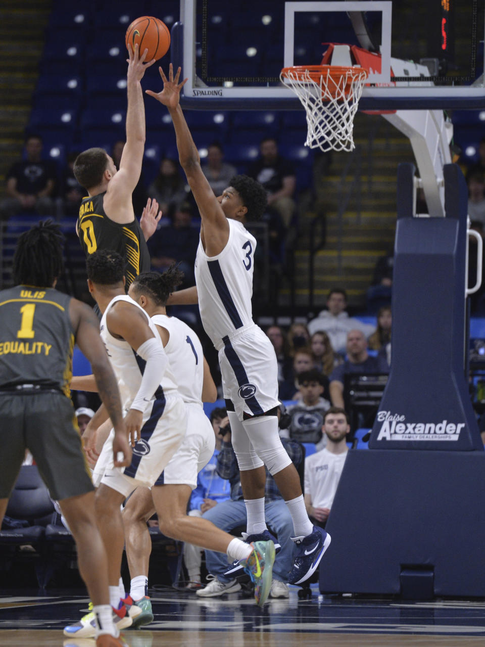 Iowa's Filip Rebraca (0) shoots over Penn State's Kebba Njie (3) during the first half of an NCAA college basketball game, Sunday, Jan. 1, 2023, in State College, Pa. (AP Photo/Gary M. Baranec)