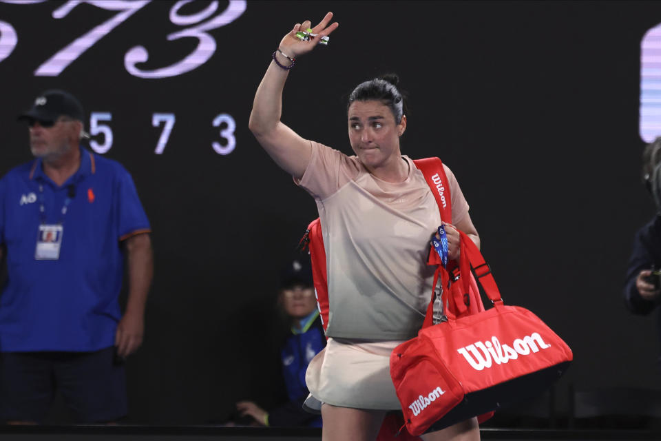 Ons Jabeur of Tunisia waves as she walks from the court following her second round loss to Mirra Andreeva of Russia at the Australian Open tennis championships at Melbourne Park, Melbourne, Australia, Wednesday, Jan. 17, 2024. (AP Photo/Asanka Brendon Ratnayake)