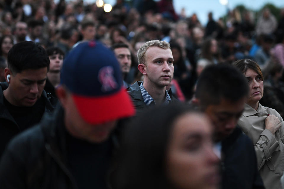 Image:  Crowds gather in front of Buckingham Palace to pay their respects following the death  of Queen Elizabeth II on Thursday. (Leon Neal / Getty Images)