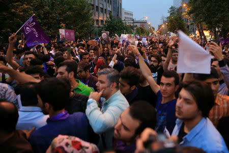 Supporters of Iranian president Hassan Rouhani celebrate his victory in the presidential election in Tehran, Iran, May 20, 2017. TIMA via REUTERS