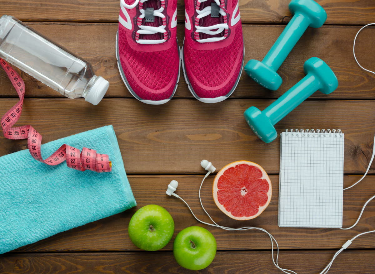 sneakers, dumbbells, tape measure, concept of the best exercise for weight loss