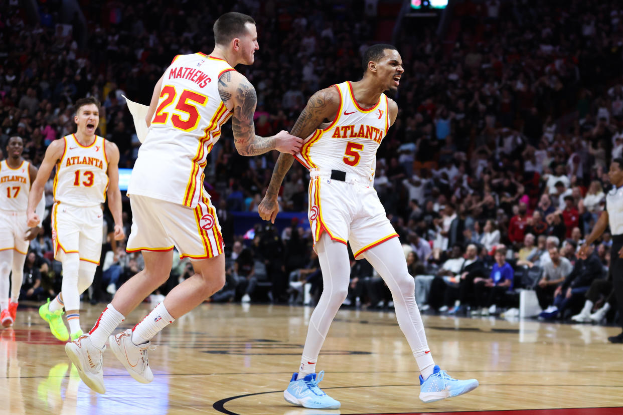 MIAMI, FLORIDA - JANUARY 19: Dejounte Murray #5 of the Atlanta Hawks reacts after making a basket against the Miami Heat during the fourth quarter of the game at Kaseya Center on January 19, 2024 in Miami, Florida. NOTE TO USER: User expressly acknowledges and agrees that, by downloading and or using this photograph, User is consenting to the terms and conditions of the Getty Images License Agreement. (Photo by Megan Briggs/Getty Images)