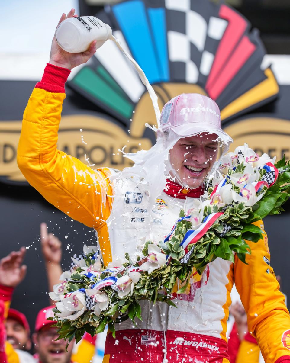 To the victor goes the milk bath: Josef Newgarden douses himself with the traditional jug of milk following his win Sunday at the Indianapolis 500.