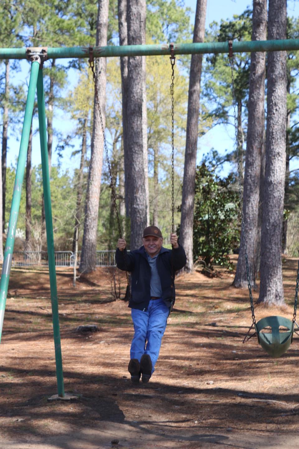 Miguel Camarillo swings at a park near Lufkin, Texas, on March 18, 2022.