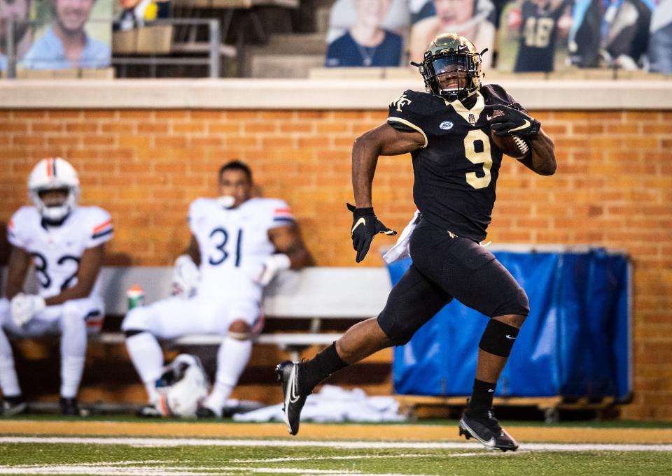 Wake Forest sophomore running back Kenneth Walker III (9) looks for pursuit as he runs the ball on his way to a touchdown on Saturday, Oct. 17, 2020 at Truist Field in Winston-Salem, N.C. (Winston-Salem Journal/Andrew Dye) 101820-wsj-spt-wakefootball