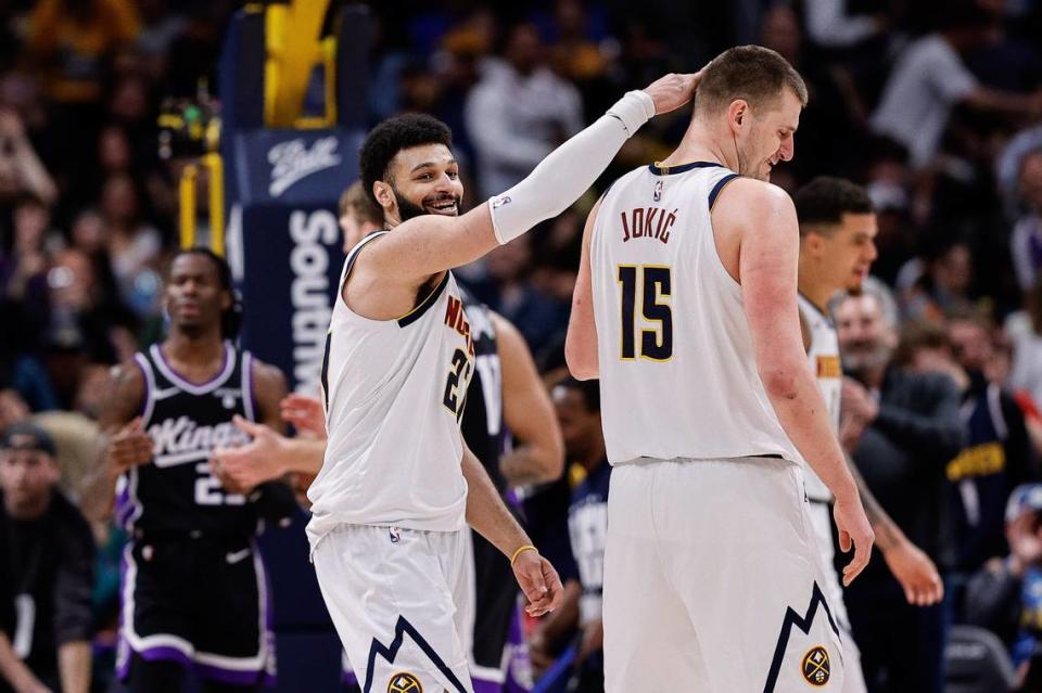 Denver Nuggets guard Jamal Murray (27) reacts with center Nikola Jokic (15) in the third quarter against the Sacramento Kings on Wednesday, Feb. 28, 2024, at Ball Arena in Denver, Colorado. Isaiah J. Downing/USA TODAY Sports