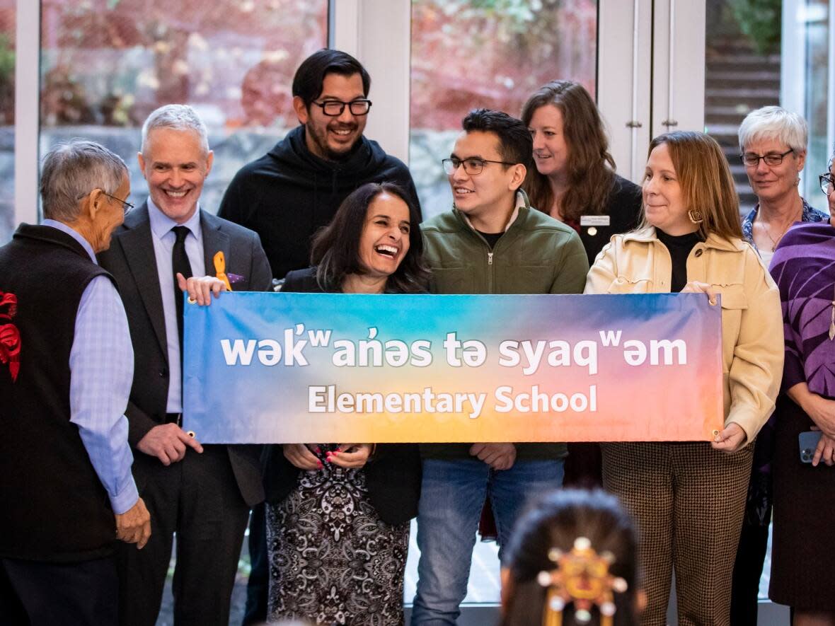 Students and faculty are pictured during the unveiling of the new name of what was formerly Sir Matthew Begbie Elementary school to wek̓ʷan̓əs tə syaqʷəm in Vancouver, B.C. on Dec. 9.  (Ben Nelms/CBC - image credit)